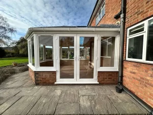 white upvc conservatory with french doors